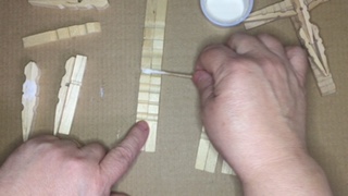 Photo of gluing first and second section of cross together.